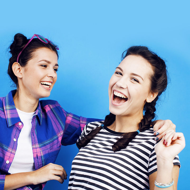 teenage girls laughing